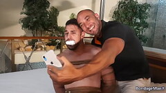 Peter tied up and mouth stuffed with sock taking selfie with Victor to expose him | PREVIEW Thumb